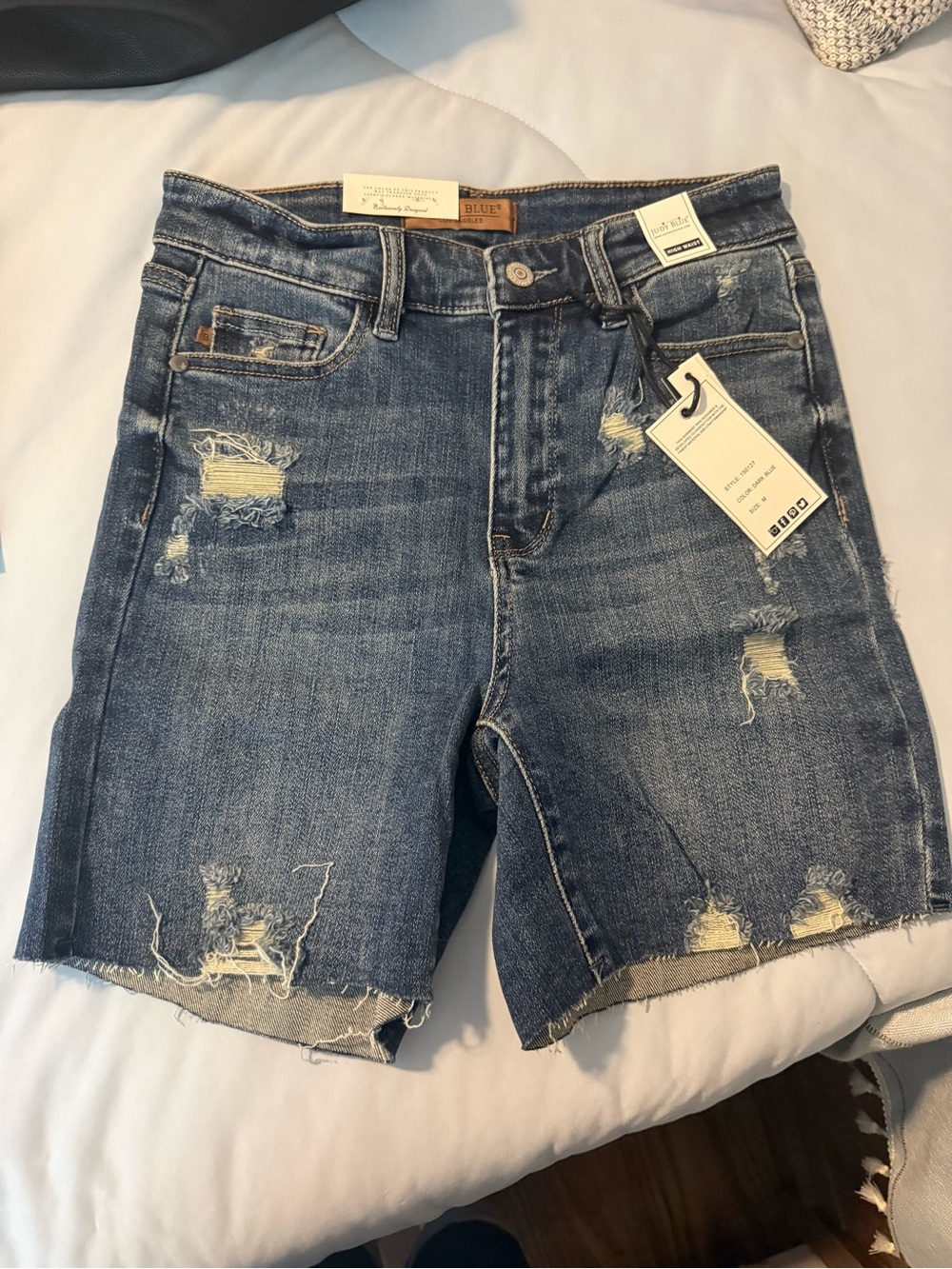 Judy Blue Distressed Denim Bermuda Shorts in Medium Blue